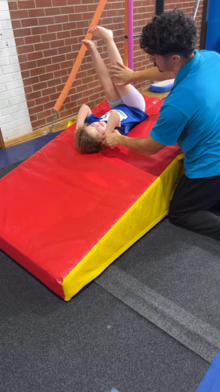 Coach Noah in action! 🤸‍♂️✨ Perfecting that backward roll down...